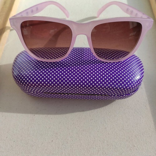 Purple sunglasses used with case