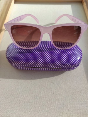 Purple sunglasses used with case