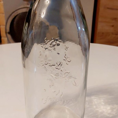 Glass bottle Frutta del Prato like new with embossed floral design