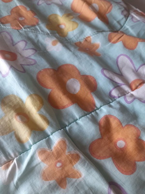 Single quilt used with two sides, floral and blue
