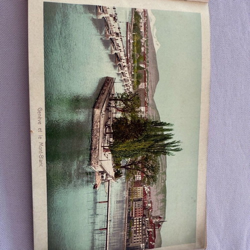 Leather-bound book with used Swiss Geneva postcard images