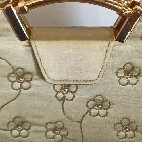 Small gold handbag with handle and long chain, like new