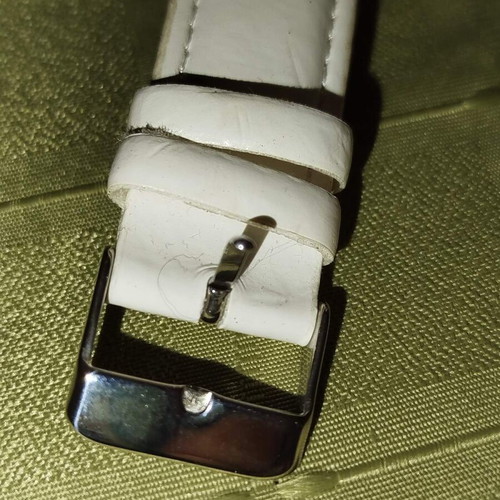 White wristwatch used with leather strap