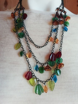 Steel necklace multistrand with colorful resin elements and black chain