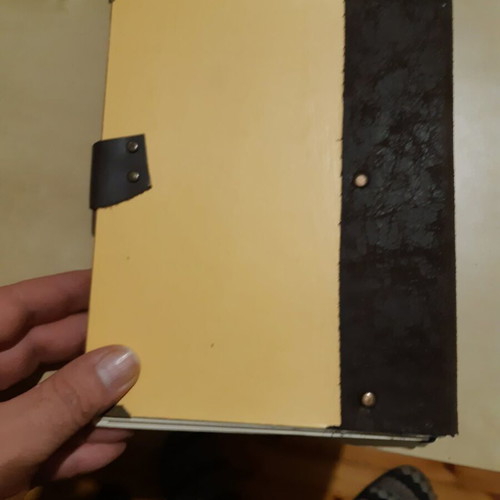Handmade multi-themed notebook like new with leather binding and metal protectors