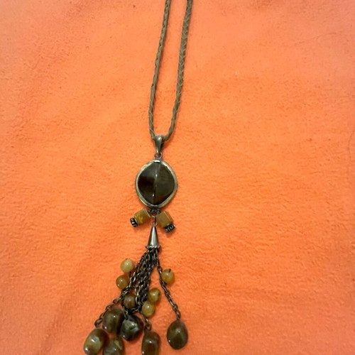 Necklace with leather strap and stones, modern design