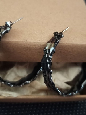 Steel hoop earrings in gun metal color like new