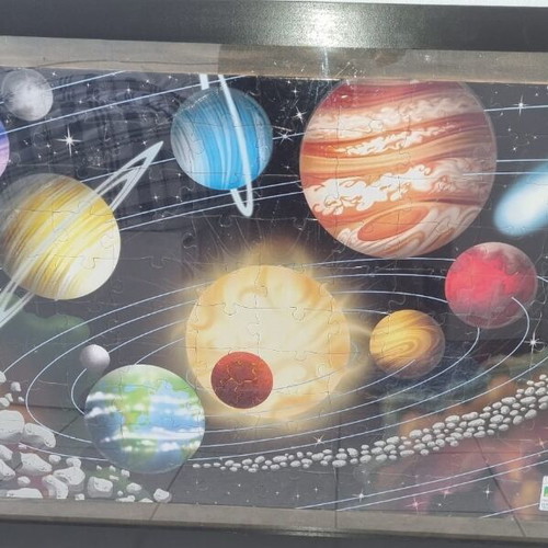 Glow-in-the-dark puzzle with planets in frame 78x108 cm like new