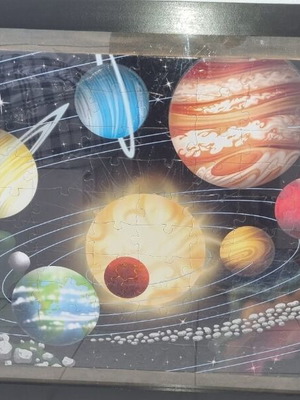 Glow-in-the-dark puzzle with planets in frame 78x108 cm like new