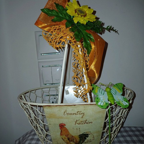 Metal basket new decorated with ribbons, flowers and butterflies