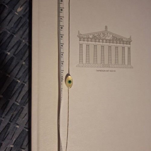 Thin bracelet with metal chain and eye centerpiece like new