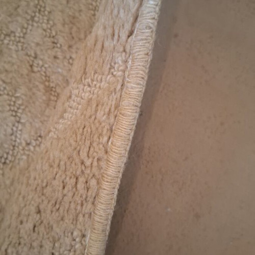 Beige rug large 1.98 × 2.90 with embossed design, used