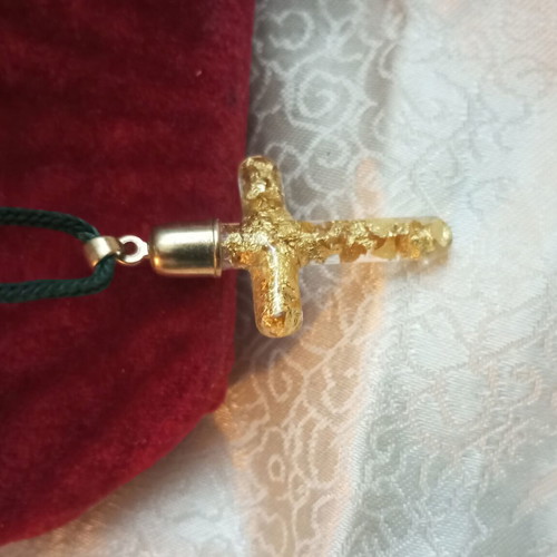 Cross with pure gold leafs in solution, metal