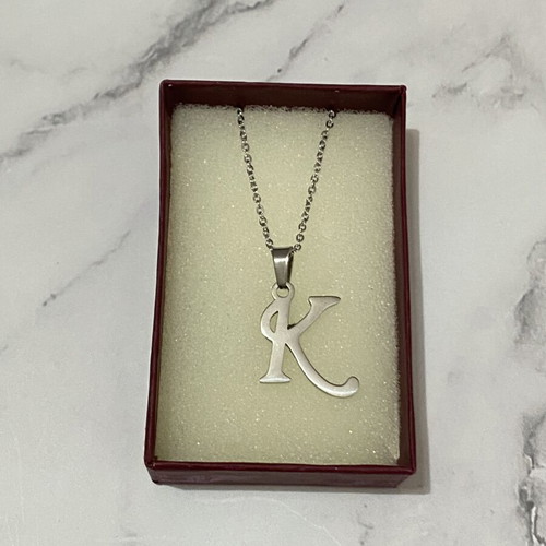 Monogram Necklace like new, silver color