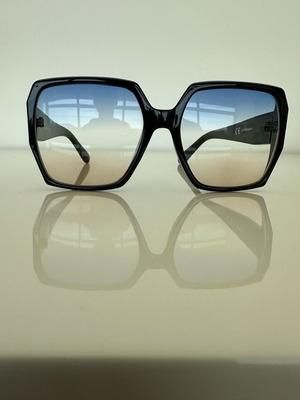 Oversize women's sunglasses new with black frame and blue lenses