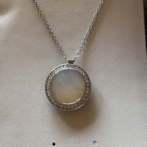 Steel necklace chain with mother-of-pearl and zircon pendant
