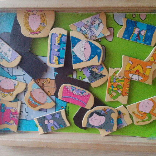 Wooden educational game with magnetic figures used, slightly worn