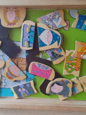 Wooden educational game with magnetic figures used, slightly worn