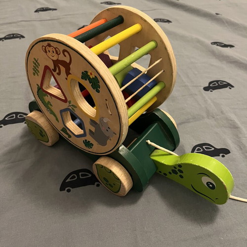 Wooden developmental toy with shapes, animals and colors like new