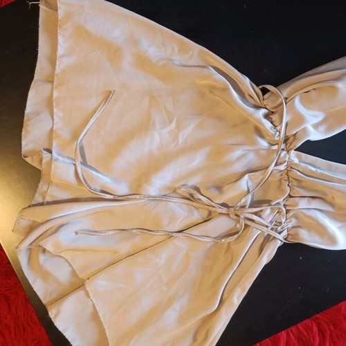 One-piece mini romper like new, gold with crisscross back