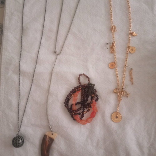 Faux jewelry used, 3 necklaces and 1 bracelet