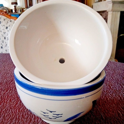 Two flower pots with blue designs
