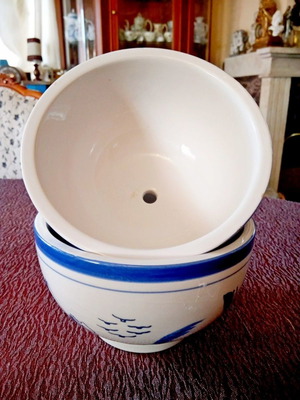 Two flower pots with blue designs