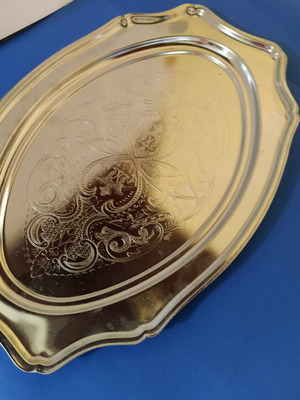 Silver-plated serving platter with embossed design, like new