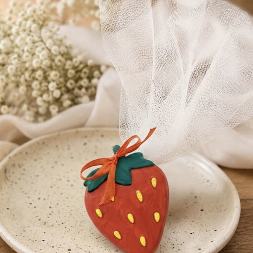 Handmade baptism bombonieres with lemon, orange, and strawberry