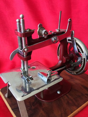 Mini vintage sewing machine made of wood and metal, functional