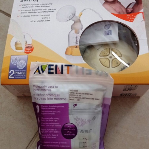 Medela Swing electric breast pump with Philips Avent storage bags