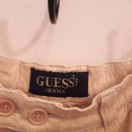 Guess women's pants used, beige with embossed patterns, size Small
