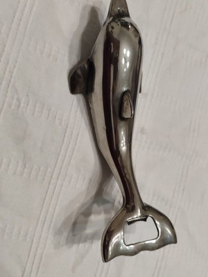 Brass dolphin-shaped bottle opener used, very good condition