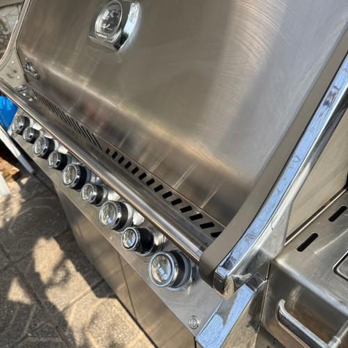 Napoleon Prestige Pro 665 gas grill used with hood and rotisserie
