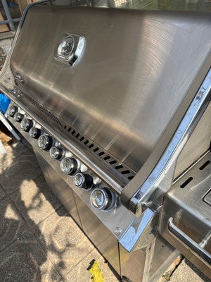 Napoleon Prestige Pro 665 gas grill used with hood and rotisserie