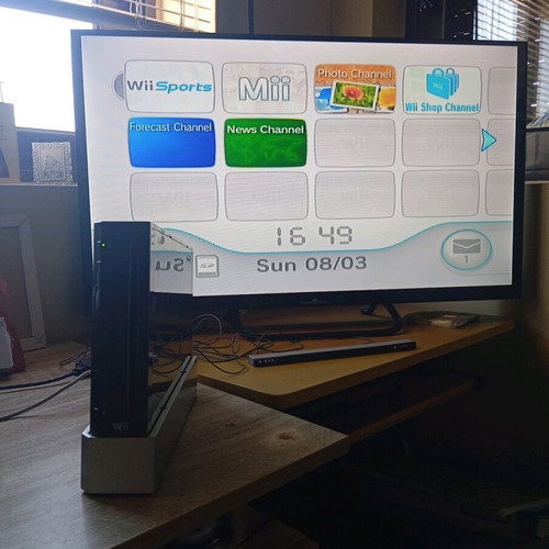 Nintendo Wii black used with Wii Motion Plus controller, nunchuk and 2 games