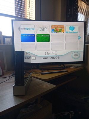Nintendo Wii black used with Wii Motion Plus controller, nunchuk and 2 games