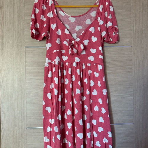 Red dress with playful white heart pattern, short sleeves, used