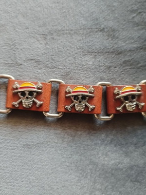 One Piece anime leather bracelet with Straw Hat skull logo used