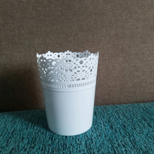 Decorative plastic flowerpot used with minor wear