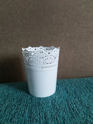 Decorative plastic flowerpot used with minor wear