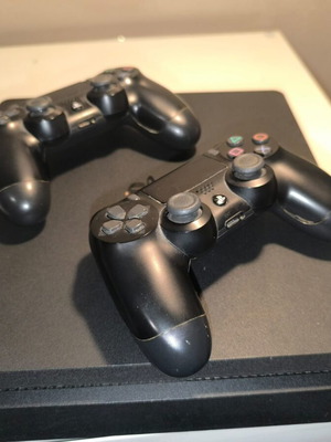 Play Station 4 Slim 1TB used with 2 original controllers