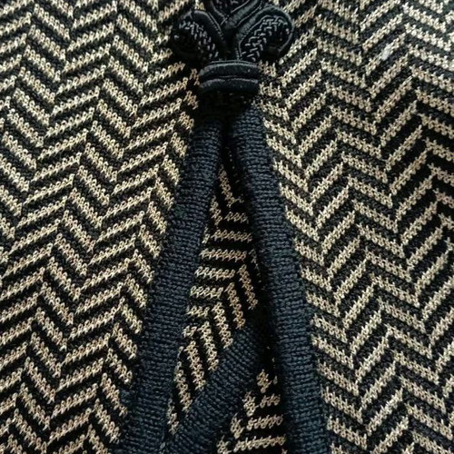 Black Kazaka with gold knit used, size L