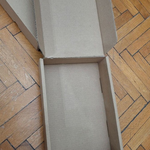 Four courier shipping boxes, kraft cardboard