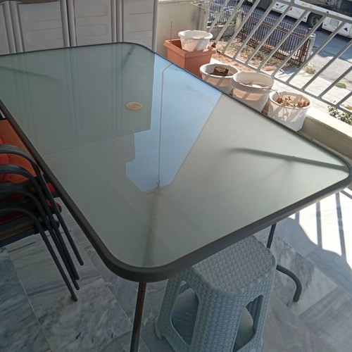 Metal table with chairs set used, large for veranda
