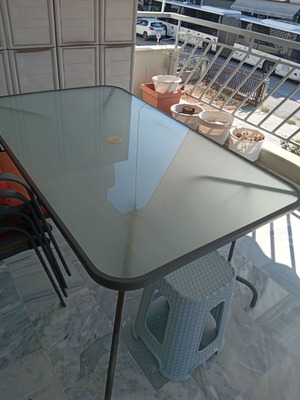 Metal table with chairs set used, large for veranda