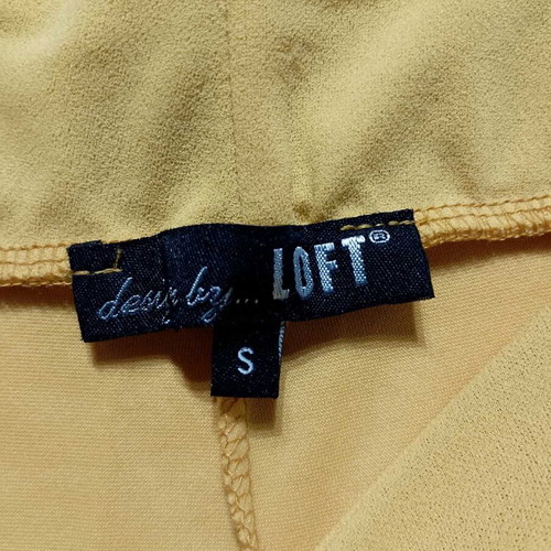 Yellow fabric pants used with elastic waist and pockets