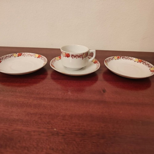 Decorative tea saucers with one cup used