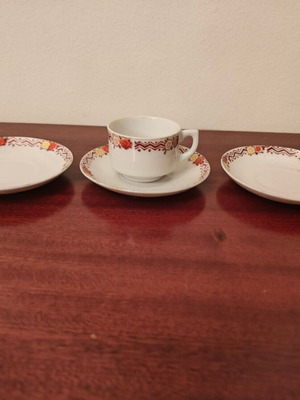 Decorative tea saucers with one cup used