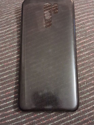 Xiaomi 9 smartphone with screen protector and case, gray